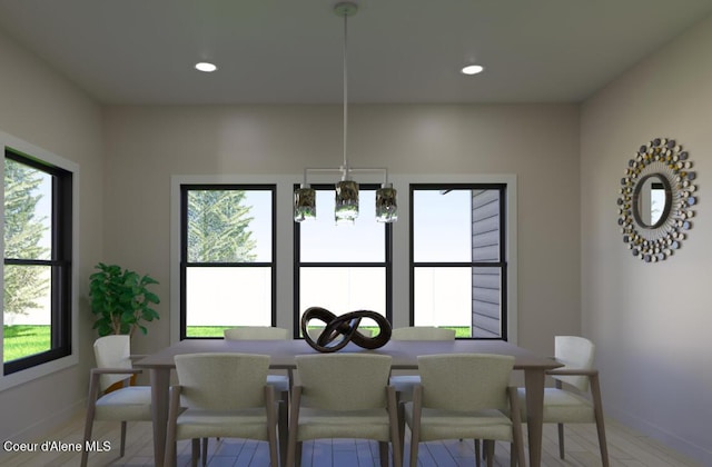 dining room featuring baseboards and recessed lighting
