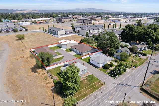 drone / aerial view featuring a mountain view and a residential view