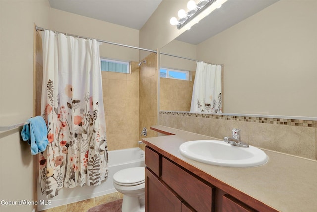 full bath with visible vents, toilet, vanity, and shower / bath combo