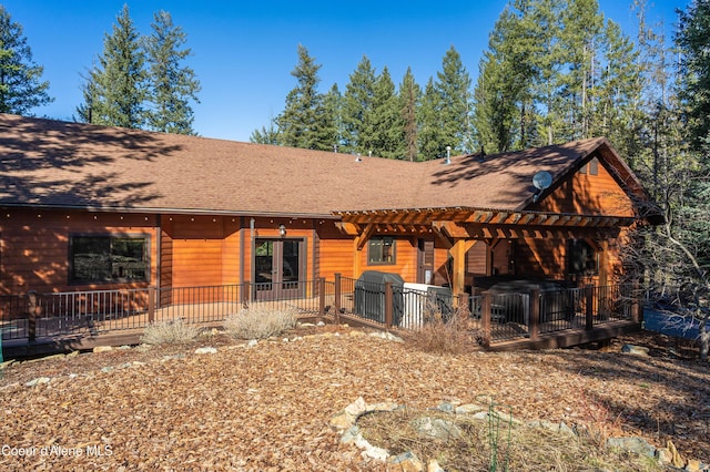 rear view of house featuring french doors, a patio, a pergola, and a shingled roof