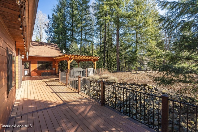 wooden terrace with a pergola