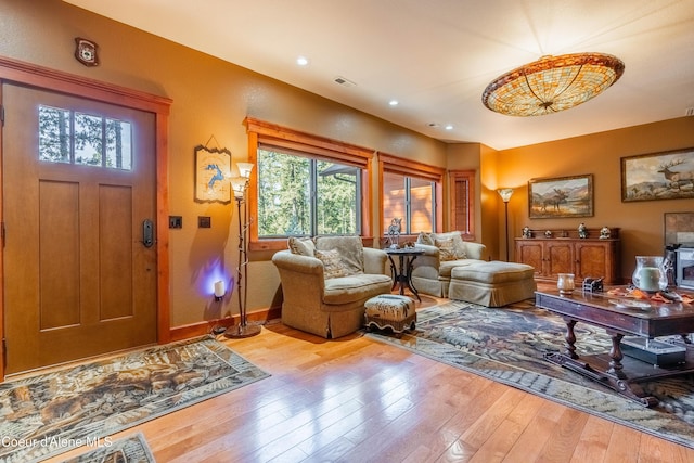 foyer featuring recessed lighting, visible vents, wood-type flooring, and baseboards