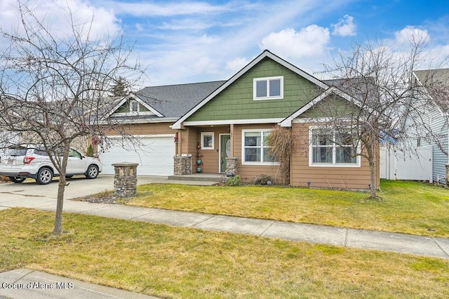 craftsman-style house featuring an attached garage, concrete driveway, and a front lawn