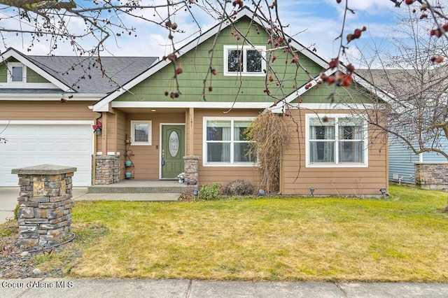 view of front facade with a front lawn and an attached garage