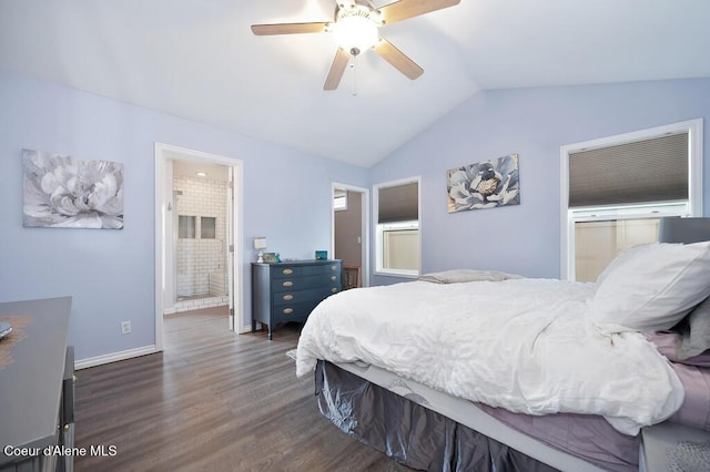 bedroom with baseboards, dark wood finished floors, lofted ceiling, ensuite bathroom, and a ceiling fan