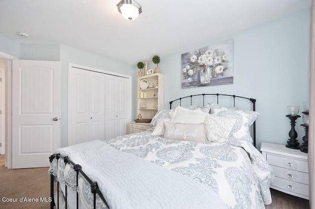 bedroom featuring a closet and wood finished floors