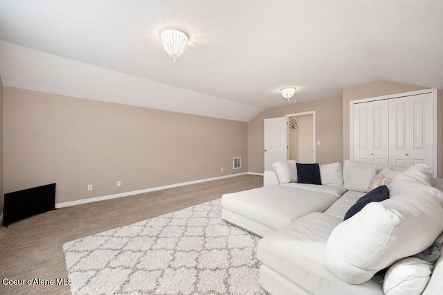 living area featuring baseboards, lofted ceiling, and visible vents