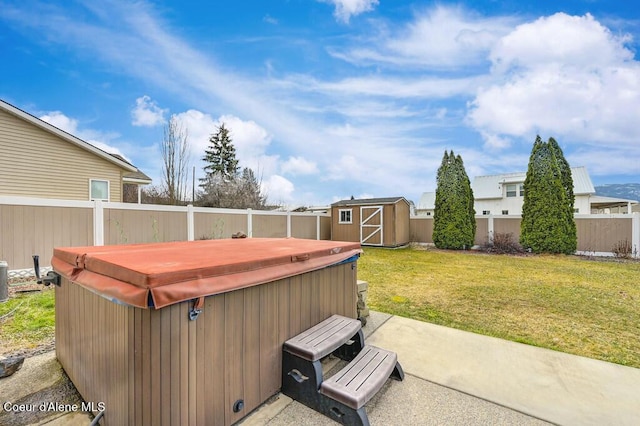 exterior space featuring an outbuilding, a storage unit, a hot tub, and a fenced backyard