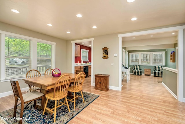 dining space with recessed lighting, light wood-style flooring, and baseboards