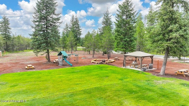 surrounding community featuring a gazebo, a lawn, and playground community