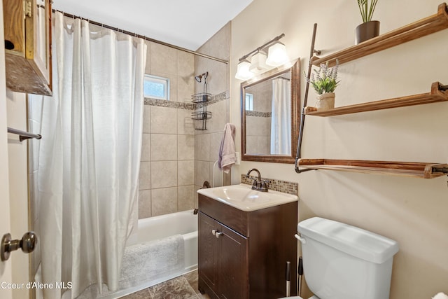 full bathroom featuring vanity, shower / bath combination with curtain, and toilet