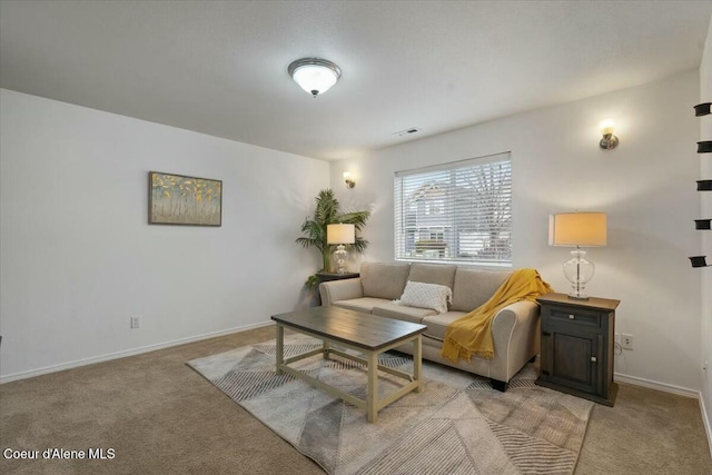 living room featuring visible vents, baseboards, and light carpet