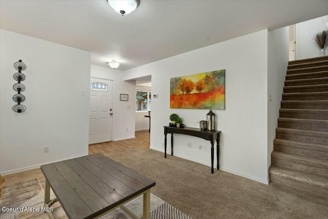 interior space featuring stairway and baseboards