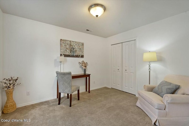 living area featuring visible vents, baseboards, and carpet floors