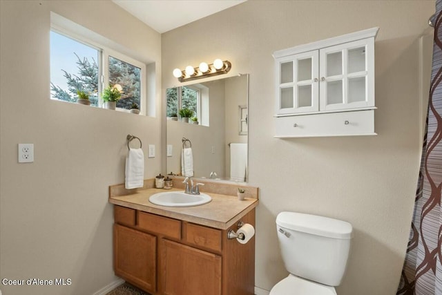 full bath with vanity and toilet