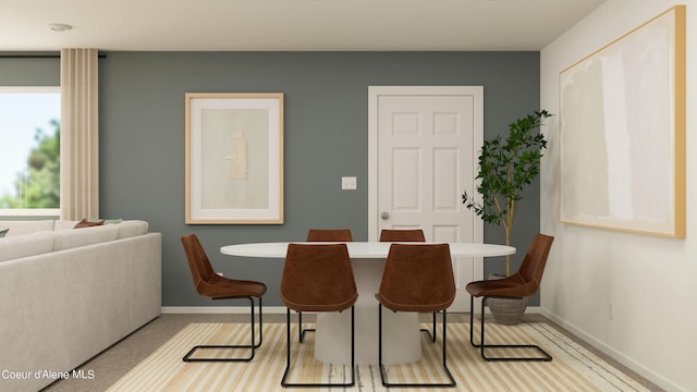 dining area featuring baseboards