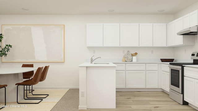 kitchen featuring under cabinet range hood, light countertops, stainless steel range with electric cooktop, white cabinets, and a sink