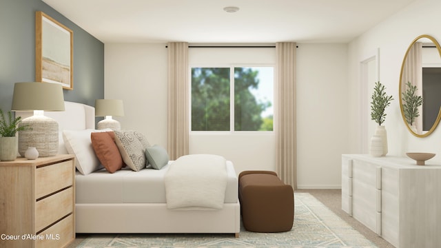 bedroom featuring light colored carpet and baseboards