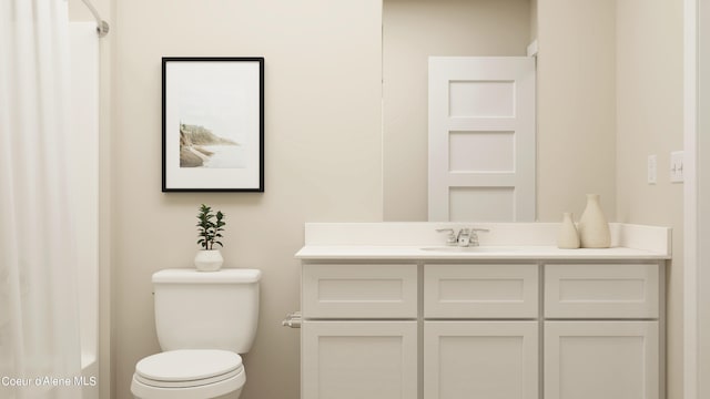 bathroom featuring toilet and vanity