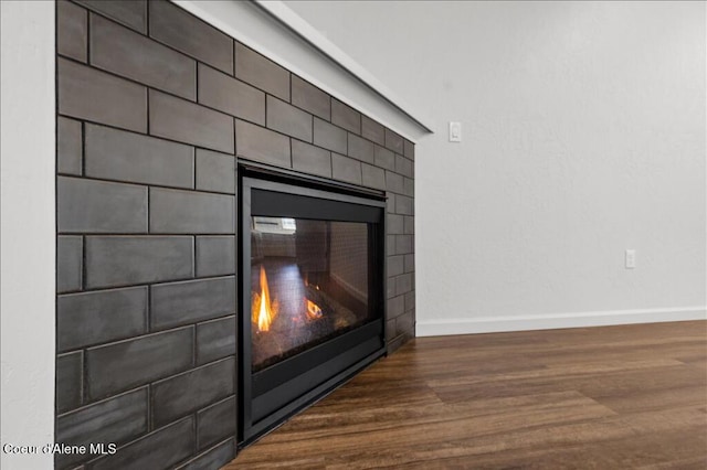 room details with baseboards and wood finished floors