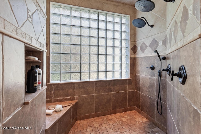 full bathroom with a healthy amount of sunlight and a tile shower