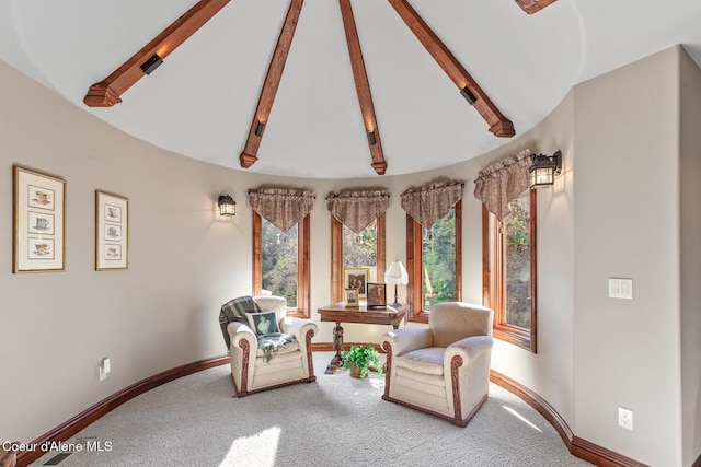 sitting room with lofted ceiling with beams, carpet flooring, and baseboards