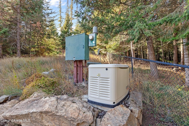 details with electric meter, a power unit, and fence