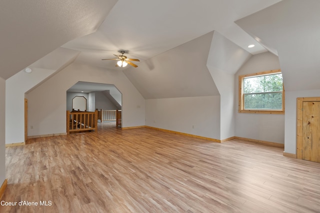 bonus room featuring lofted ceiling, a ceiling fan, and light wood finished floors