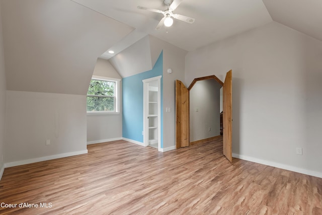 bonus room with baseboards, lofted ceiling, light wood-style flooring, recessed lighting, and ceiling fan