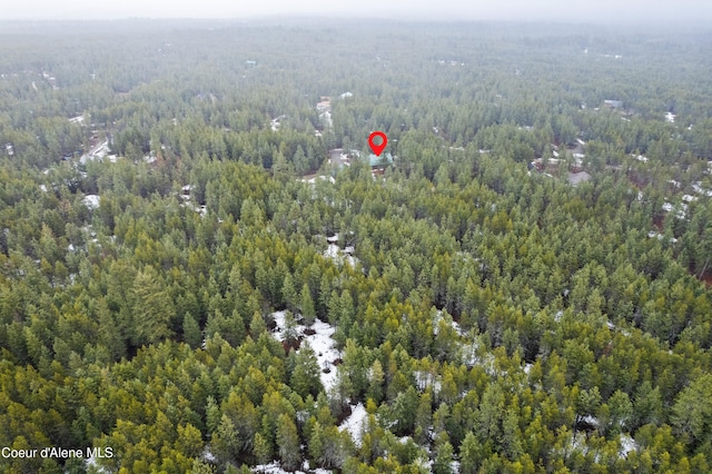 aerial view featuring a view of trees