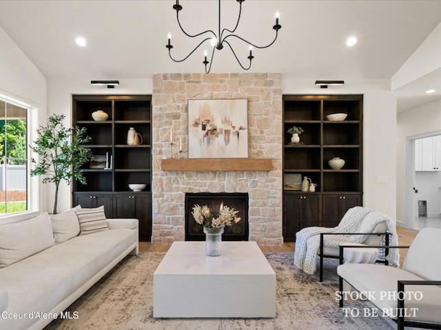 living room featuring a chandelier, recessed lighting, built in shelves, and wood finished floors