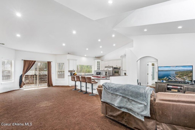 32722 N 10th Ave, Spirit Lake, ID 83869 - living room with recessed lighting, dark carpet, high vaulted ceiling, and arched walkways