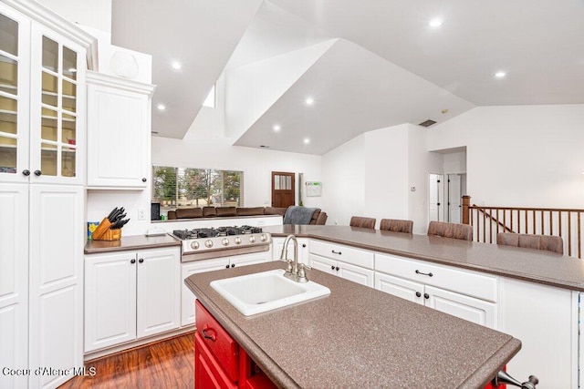 32722 N 10th Ave, Spirit Lake, ID 83869 - kitchen with a sink, vaulted ceiling, an island with sink, open floor plan, and stainless steel gas stovetop