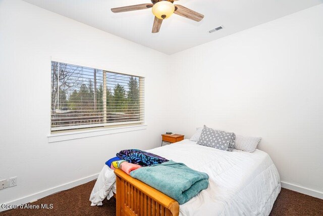 32722 N 10th Ave, Spirit Lake, ID 83869 - bedroom with carpet, baseboards, and a ceiling fan