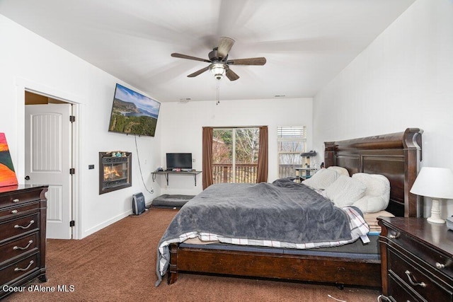 32722 N 10th Ave, Spirit Lake, ID 83869 - bedroom with carpet, baseboards, a ceiling fan, and access to exterior