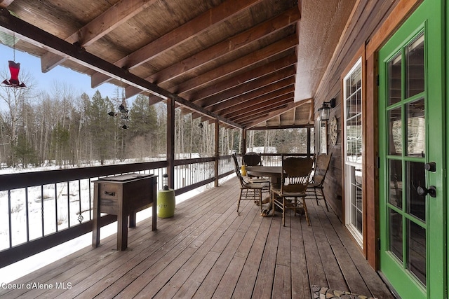 wooden deck with outdoor dining area