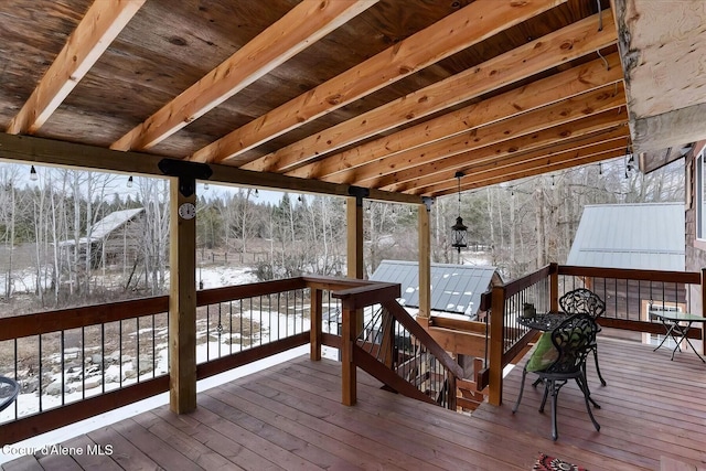 view of snow covered deck