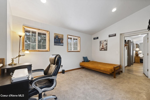 office space featuring lofted ceiling, baseboards, and carpet floors