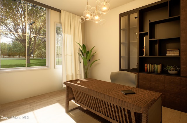 office featuring an inviting chandelier and wood finished floors