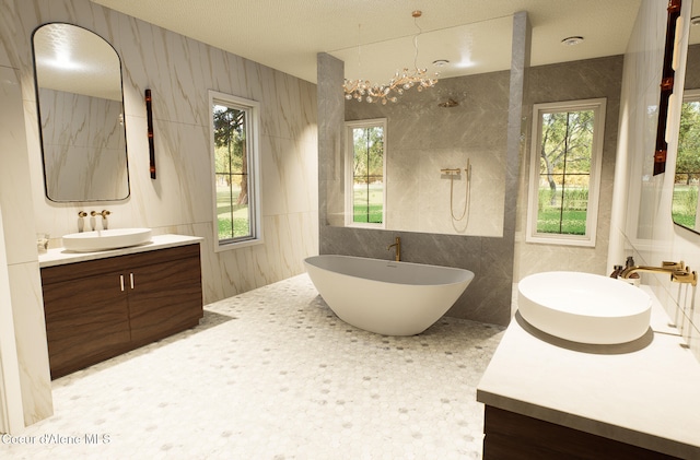 bathroom with tile walls, two vanities, and a sink