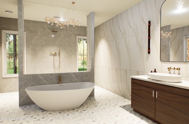 full bathroom with tile walls and a chandelier