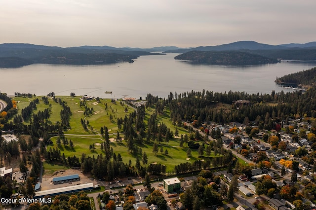 birds eye view of property with a water and mountain view