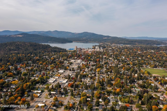 drone / aerial view with a water and mountain view