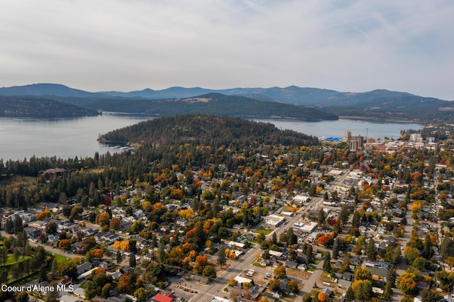 drone / aerial view with a water and mountain view