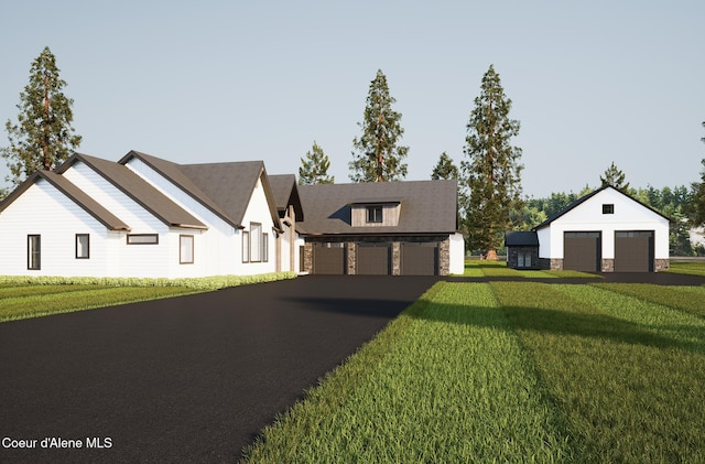 modern inspired farmhouse featuring a garage, stone siding, and a front lawn