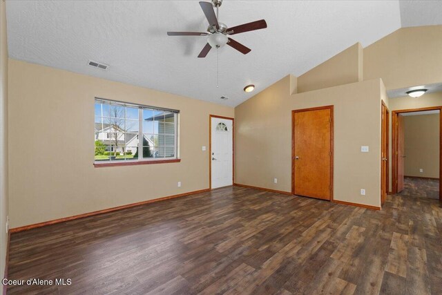 8920 N Torrey Ln, Hayden, ID 83835 - unfurnished living room featuring visible vents, wood finished floors, baseboards, ceiling fan, and high vaulted ceiling
