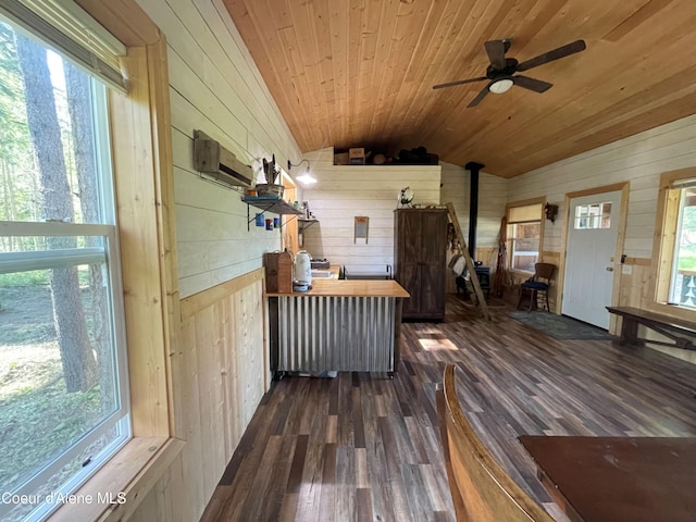 1942 Two Tail Rd, Bonners Ferry, ID 83805 - sunroom / solarium with a wood stove, lofted ceiling, and healthy amount of natural light