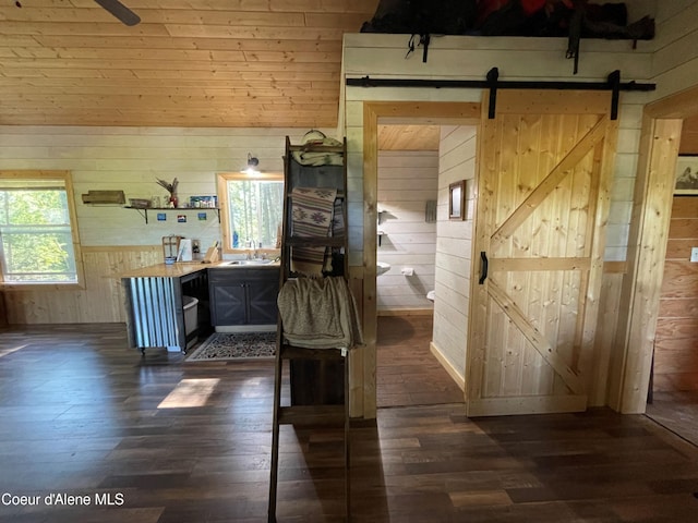 1942 Two Tail Rd, Bonners Ferry, ID 83805 - bathroom with wooden walls and hardwood / wood-style flooring