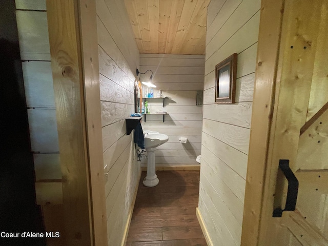1942 Two Tail Rd, Bonners Ferry, ID 83805 - half bathroom with wooden walls, wooden ceiling, and wood finished floors