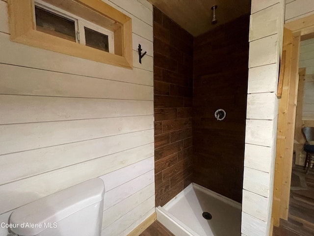 1942 Two Tail Rd, Bonners Ferry, ID 83805 - bathroom featuring wood walls and a stall shower